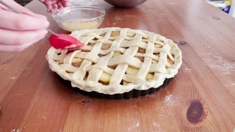 Apple pie making process. Painting the tart with egg before baking. Stock Footage 219640725