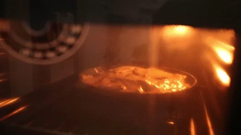 Apple pie in the oven. Stock Footage 70240051