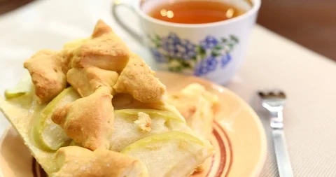 Apple pie piece and cup of tea. Fresh homemade fruit apple tart. Stock Footage 87511345