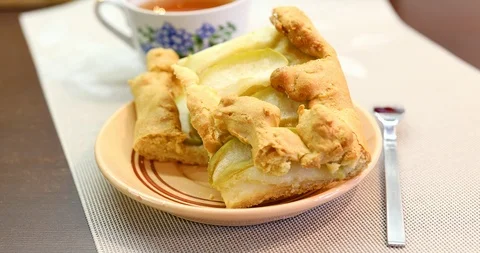 Apple pie piece and cup of tea. Fresh homemade fruit apple tart. Stock Footage 87514896