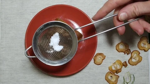 Apple pie on a red plate powdered with sugar above Stock Footage 103148043