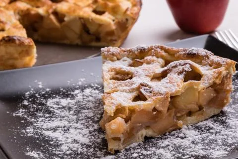 Apple pie slice on black plate Stock Photos