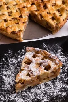 Apple pie slice on black plate Stock Photos