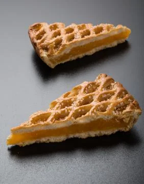 Apple pie slice on black table Stock Photos