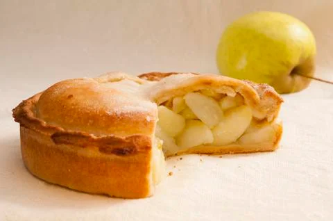 Apple Pie with Slice Missing and Fresh Apple Stock Photos