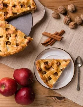 Apple pie slice on rustic setting Stock Photos