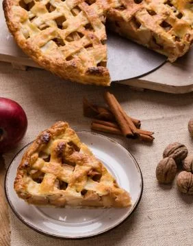 Apple pie slice on rustic setting Stock Photos