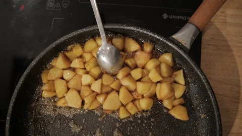 Apple pieces Caramelizing in a Pan Stock Footage 85861309
