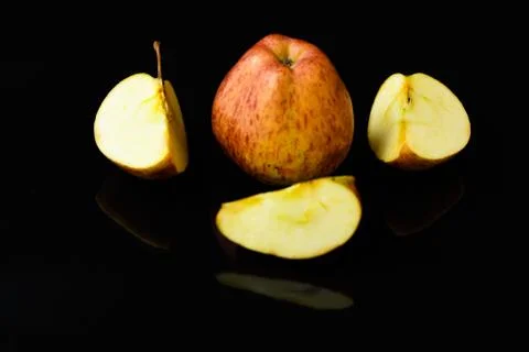 Apple pieces on isolated black background Stock-Fotos