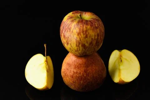 Apple pieces on isolated black background Stock Photos