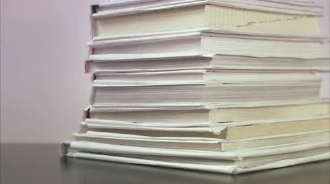 An apple on a pile of books Stock Footage 11289948
