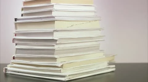 An apple on a pile of books Stock Footage 11289955