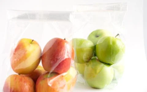 Apple in plastic bag 스톡 사진