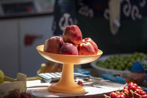 Apple in a plastic plate Stock Photos