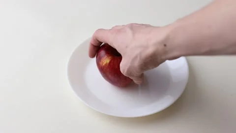 The apple is on a plate Stock Footage 145536615