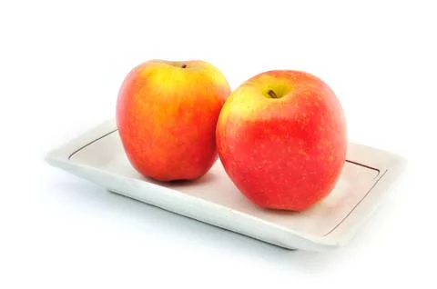 Apple on plate Stock Photos