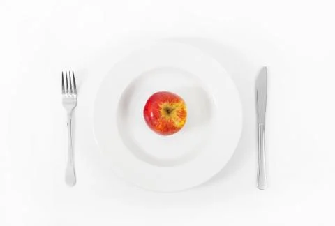 Apple on plate Stock Photos
