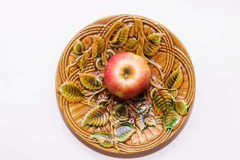 Apple on a plate on a platter on a white Stock Photos