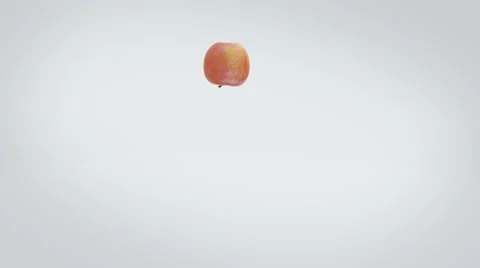 An apple playfully bouncing along, center screen. Stock Footage 57814268