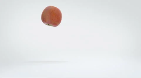 An apple playfully bouncing along. Stock Footage 57814302