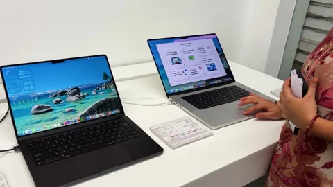 Apple Premium Laptop Collection Displayed On Retail Counter In Modern apple Stock Footage 340957906