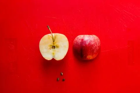 Apple on a red background Stock Photos