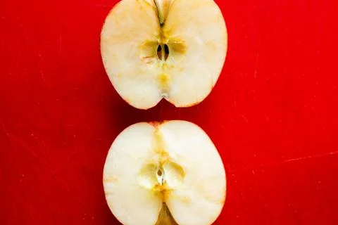 Apple on a red background Stock Photos