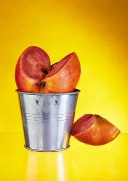 An apple with red pulp inside with a carved wedge on the background of a buck Stock Photos