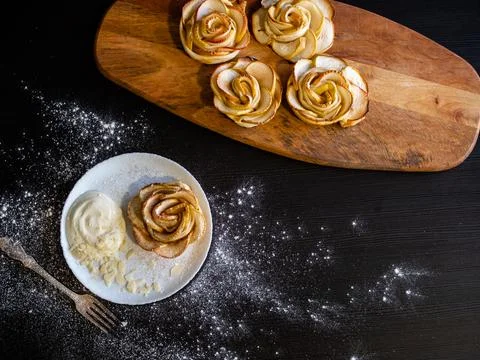Apple roses, apple buns, serving with whipped cream and almond petals, Stock Photos
