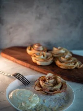 Apple roses, apple buns, serving with whipped cream and almond petals, Stock Photos