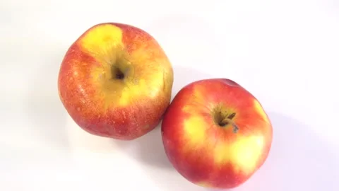Apple rotate, side view, spinning slowly in a circle, close up. Stock Footage 165474833