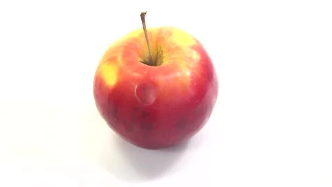 Apple rotate, side view, spinning slowly in a circle, close up. Stock Footage 165474857