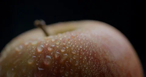 Apple rotating close-up / macro with water spray slowmotion 4k Stock Footage 93274308