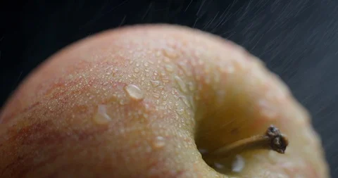Apple rotating close-up / macro with water spray slowmotion 4k Stock Footage 93274397
