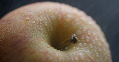 Apple rotating close-up / macro with water spray slowmotion 4k Stock Footage 93274453