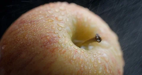Apple rotating close-up / macro with water spray slowmotion 4k Stock Footage 93274472