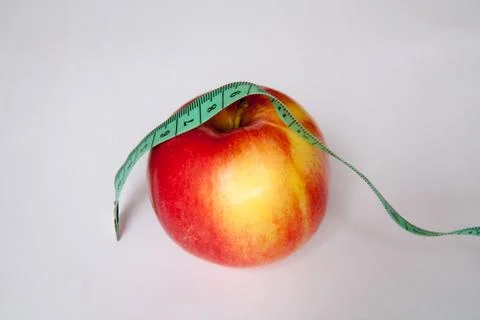 Apple with a ruler Stock Photos