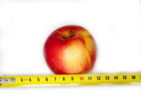 Apple with a ruler Stock Photos