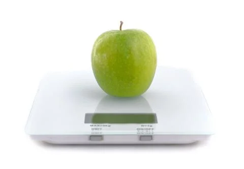 Apple on a scale Stock Photos