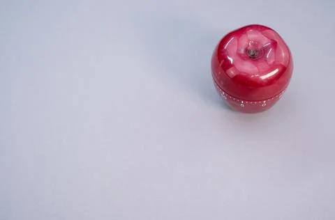 Apple-shaped kitchen timer isolated on light blue background 스톡 사진