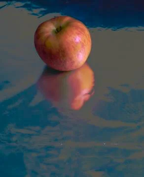 Apple on silver ground Stock Photos
