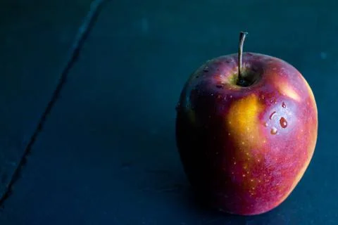 Apple on slate and rustic background, raw food Stock Photos