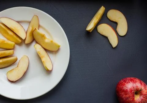 Apple sliced on a cutting board Stock Photos