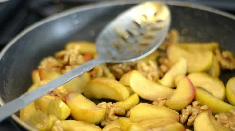 Apple slices being fried Stock Footage 12601499