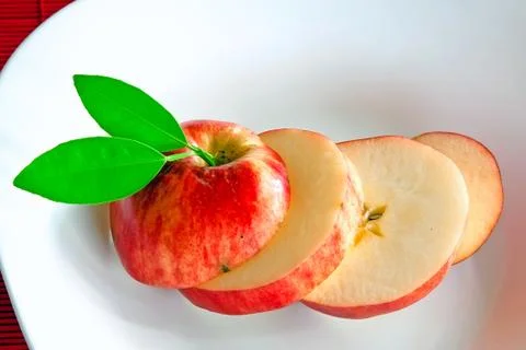 Apple slices on dish Stock Photos