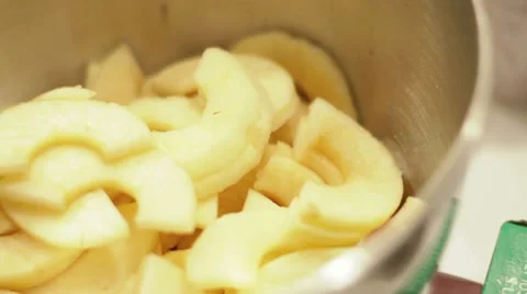 Apple slices dropping into bowl Stock-Footage 10317897