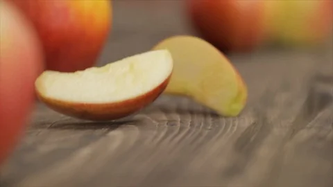 Apple Slices Falling between Whole Apples Closeup No. 1 Stock Footage 99137300