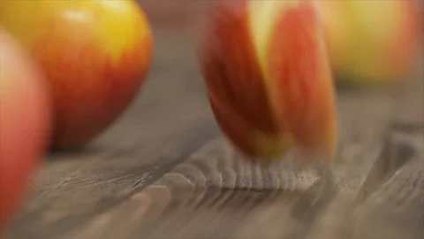 Apple Slices Falling between Whole Apples Closeup No. 2 Stock Footage 99137314