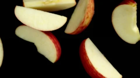 Apple Slices Falling in Slow Motion Stock Footage 314894156