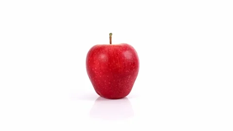 Apple spinning on white background Stock Footage 220023279